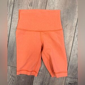 Lululemon Wunder Train High-Rise shorts in a textured coral